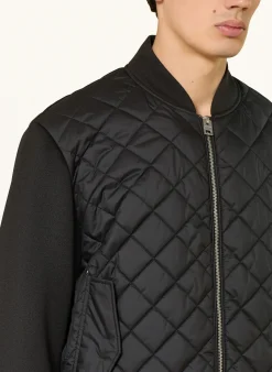 Steppjacke im Materialmix